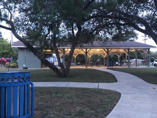 The lights come on under the pavilion at night