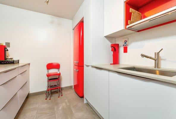 Red & White Galley Kitchen by Leicht