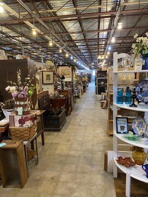 View down one aisle looking from the back of the store towards the front