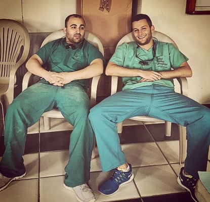 Dr. Michael Faynzilberg (right) and Dr. Jahan Monirian (left) taking a break between patients seen with JAAC in Jamaica