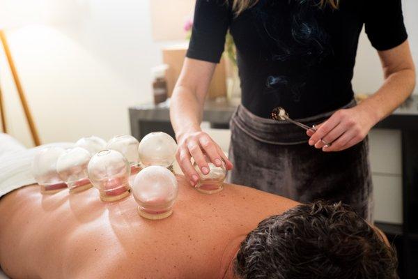 Treatments often incorporate supportive modalities like cupping, moxibustion, essential oils, and tuina massage.