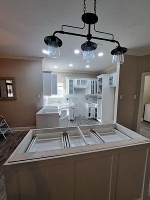 Drywall repair and painting cabinets