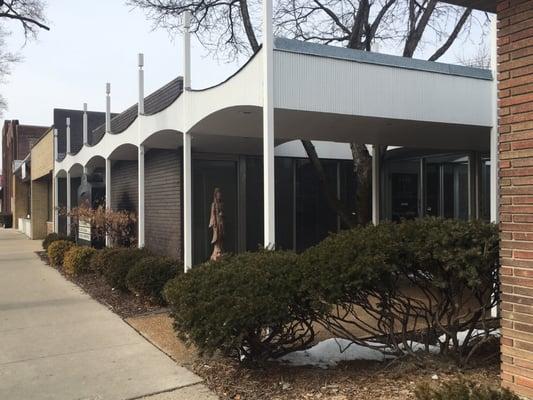 A view from the sidewalk on Peterson. Look for the unique white & brick building!