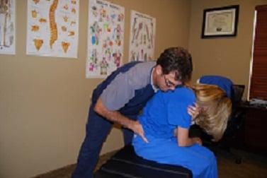 Dr. St. Onge providing Active Release treatment to the patients lumbar muscles.  ART is an important part of our treatment.