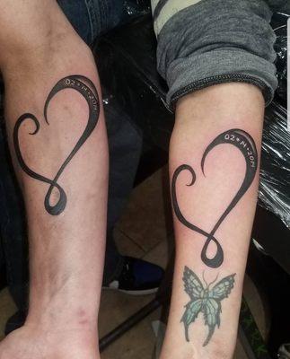 Matching anniversary tattoos by Danaysia and Marcus done at same time! That's skill! They're perfect.