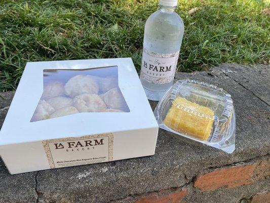 White chocolate baguettes, lemon square, and water