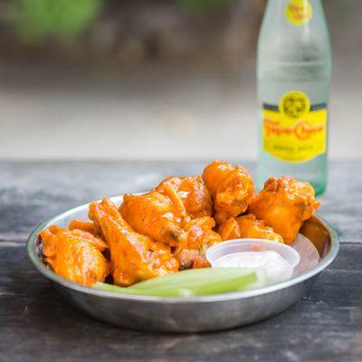 Classic Buffalo Wings, eight piece bone-in chicken with wing sauce, celery, and your choice of buttermilk ranch or chunky blue cheese