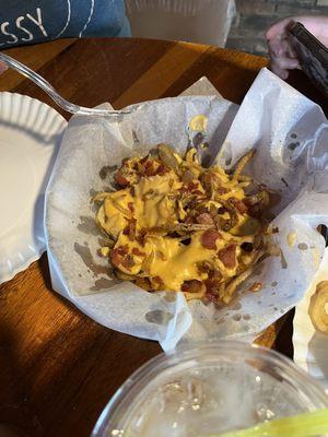 Shoestring potatoes with bacon & cheese