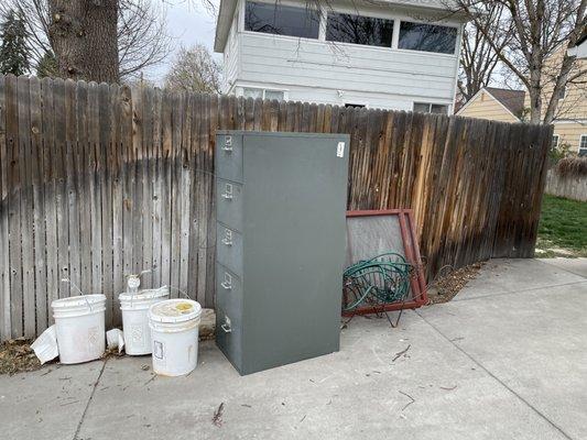 Before - heavy file cabinet and odd cans