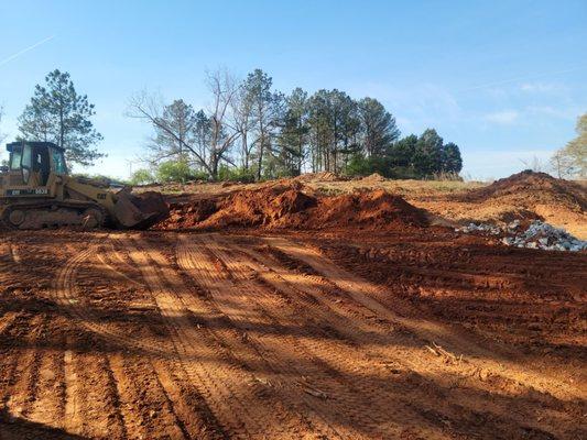 Lot leveling and excavation services.