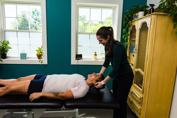 Dr. Alicia Kowsky providing a manual therapy treatment for neck pain