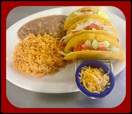 3 beef or chicken tacos served with rice and beans