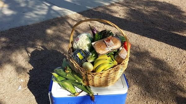 My conventional basket plus the Grill Pack add on.  This week we got melon, cauliflower,  broccoli,  grape tomatoes and more.