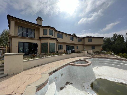 Milgard Ultra Black On Black Windows installed at gorgeous La Canada House , all new construction installation exterior fresh stucco