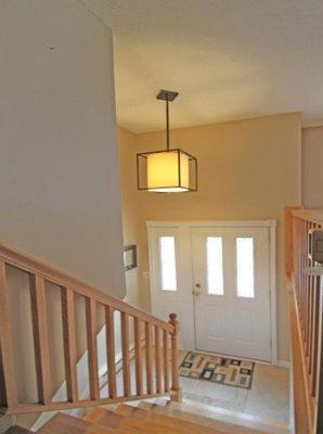 Entryway Remodel - Installed light fixture, railing, and tile floor.