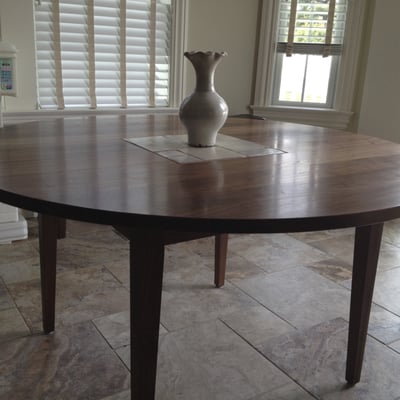 Walnut dining table with handmade ceramic tile inlaid into the top.  55" dia.