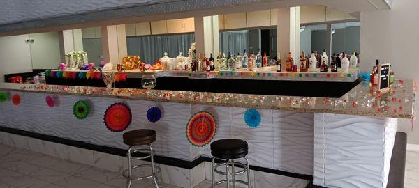 We stocked our own bar, hired our own batender and catering from Mama's love cooking. Off Facebook.