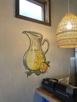 Mural of a pitcher of lemonade toward the back