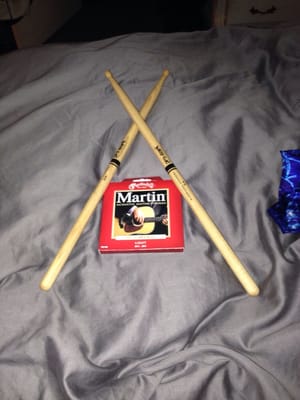 Got some sticks to bang my drums to my hearts content and some new strings to try and help my beat up old guitars sound!