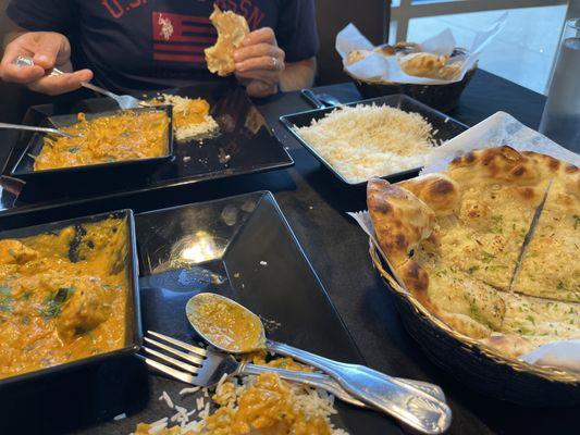 fish tikka masala and chicken tikka masala with butter naan and garlic naan