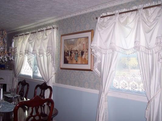 Installed new double paned replacement windows.  Hung curtain rods and curtains.