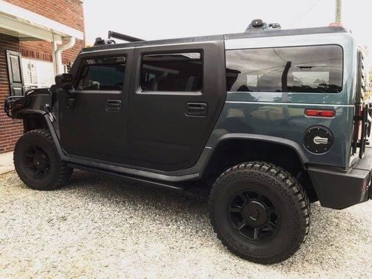 Matte black door wrap with carbon fiber wrap accents