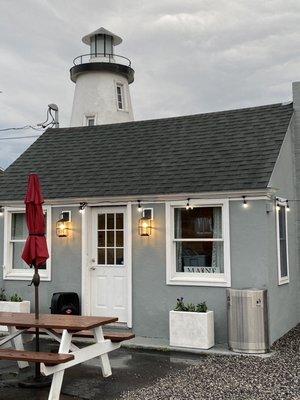 Cute building with a light house