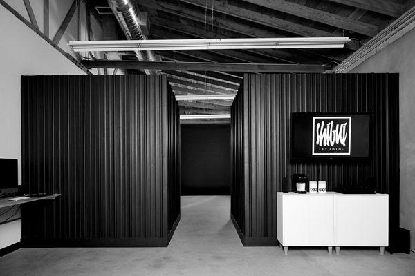 Front office area featuring the snack station, playback TV, and conference table.