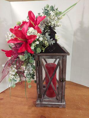 Natural wood lantern with metal top. Dressed in your choice of color theme. Stands 18" high and 7" wide. Candle included