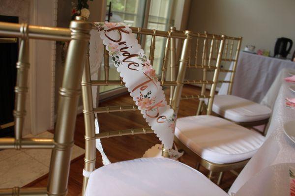 Their gold chair + cushion for a bridal shower I decorated