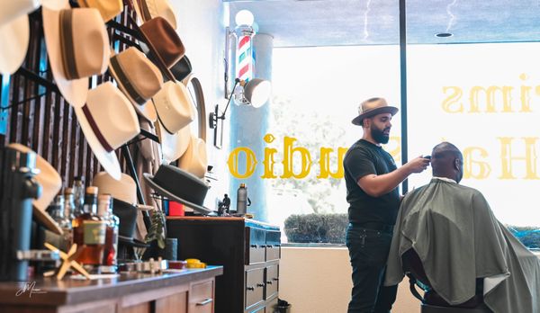 Argenis, one of our barbers working on a haircut.