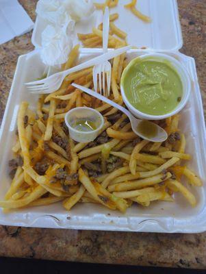 Nacho cheese carne asada fries 100% garbage $5 for fake guacamole