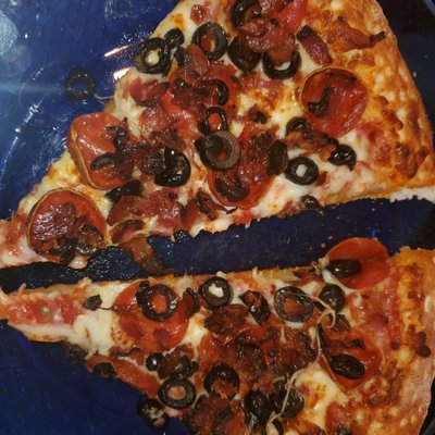 Pepperoni, bacon and olives cooked to perfection