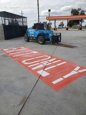 Anderson Striping striping at a gas station in Fresno!