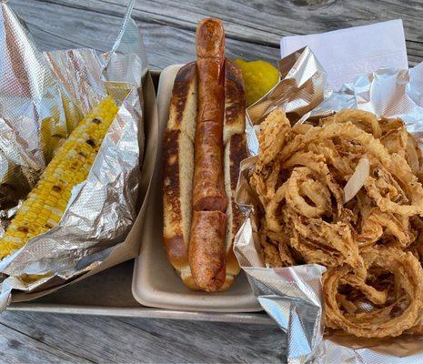 The corn was fresh, the hotdog was fried, and unfortunately, the onion rings were cold and tasted old.