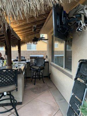 Side view of bbq island/palapa with TV, fan, and LED light strip added.