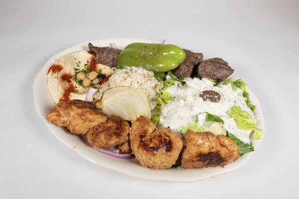 Shish Kebab - (Chicken, Beef, Kafta, Lamb, Shrimp or combination) Served with Feta cheese salad, Hummus and rice.