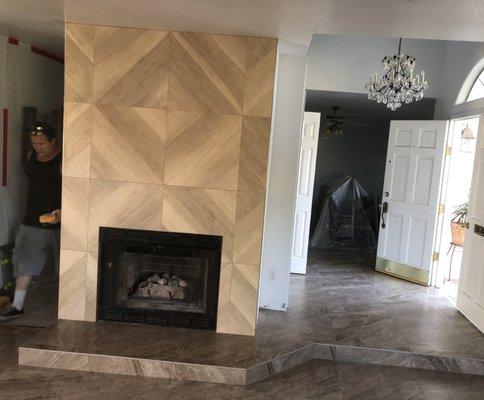 Another Gaytan Tile job. Fireplace, entry way and living room