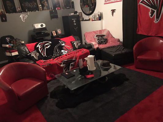 Falcons room with custom red border around black carpet insert