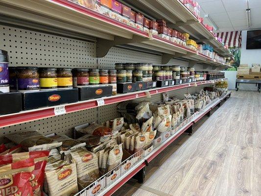 Variety of spices, mixed pickled vegetables, and ginger / garlic pastes