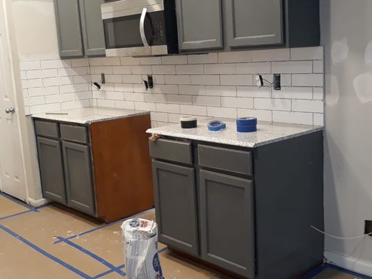 back splash installed cabinets sanded to repaint