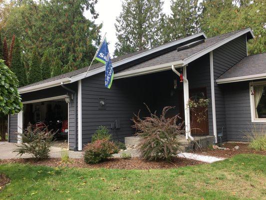 Exterior repaint:
 Sherwin Williams SuperPaint
 Siding SW7674 'Peppercorn'
 Trim SW7005 'Pure White'
 Go Hawks!