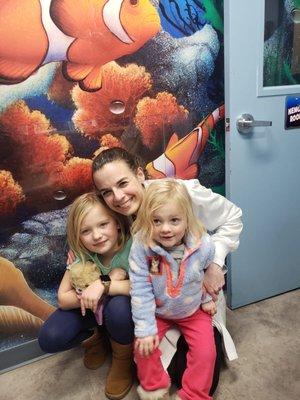 Dr. Gabby with her patients. Happy to be cavity-free and clean, healthy, smiles!