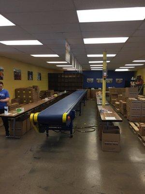 The sorting room. We spent a 3 hour shift here packing canned goods by category. It was fun and fast-passed.