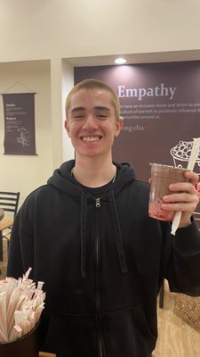 Mans holding a strawberry chocolate latte