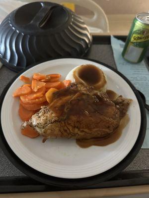 Roasted chicken breast with gravy and mashed potatoes