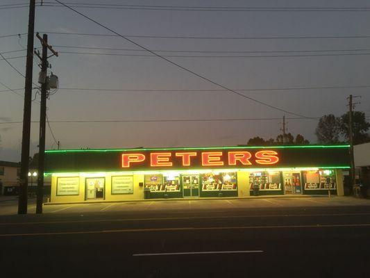 The neon-lit nighttime front exterior of this store can be seen in the film, Mr. Brooks. The scene involves Kevin Costner and Dane Cook.