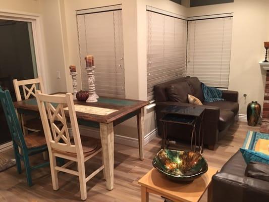 My fabulous table with the turquoise and cream chairs and leather Marin loveseat. ( Marin couch out of camera range) from House to Home.