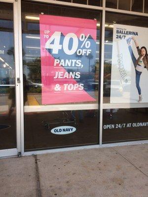 A close up of the sign clearly stating the 40% sale for pants, jeans, & tops (which the jeans I chose were not on sale. At all.)