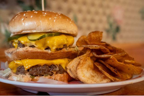 The Big J Burger.  Two 112 smash burger patties, fancy sauce, lettuce, pickles and onions on a sesame seed bun.  GF, DF Plant based options